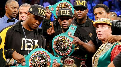 mayweather with all his belts.